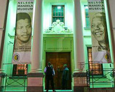 Facade of the Nelson Mandela Museum in Mthatha at night.