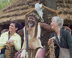 Visitors to Shangana Cultural Village have their picture taken with the 'chief'.