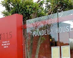 Modern perimeter fence and entrance for the small plot and house where Nelson Mandela stayed in Soweto before being incarcerated by the Apartheid Government.